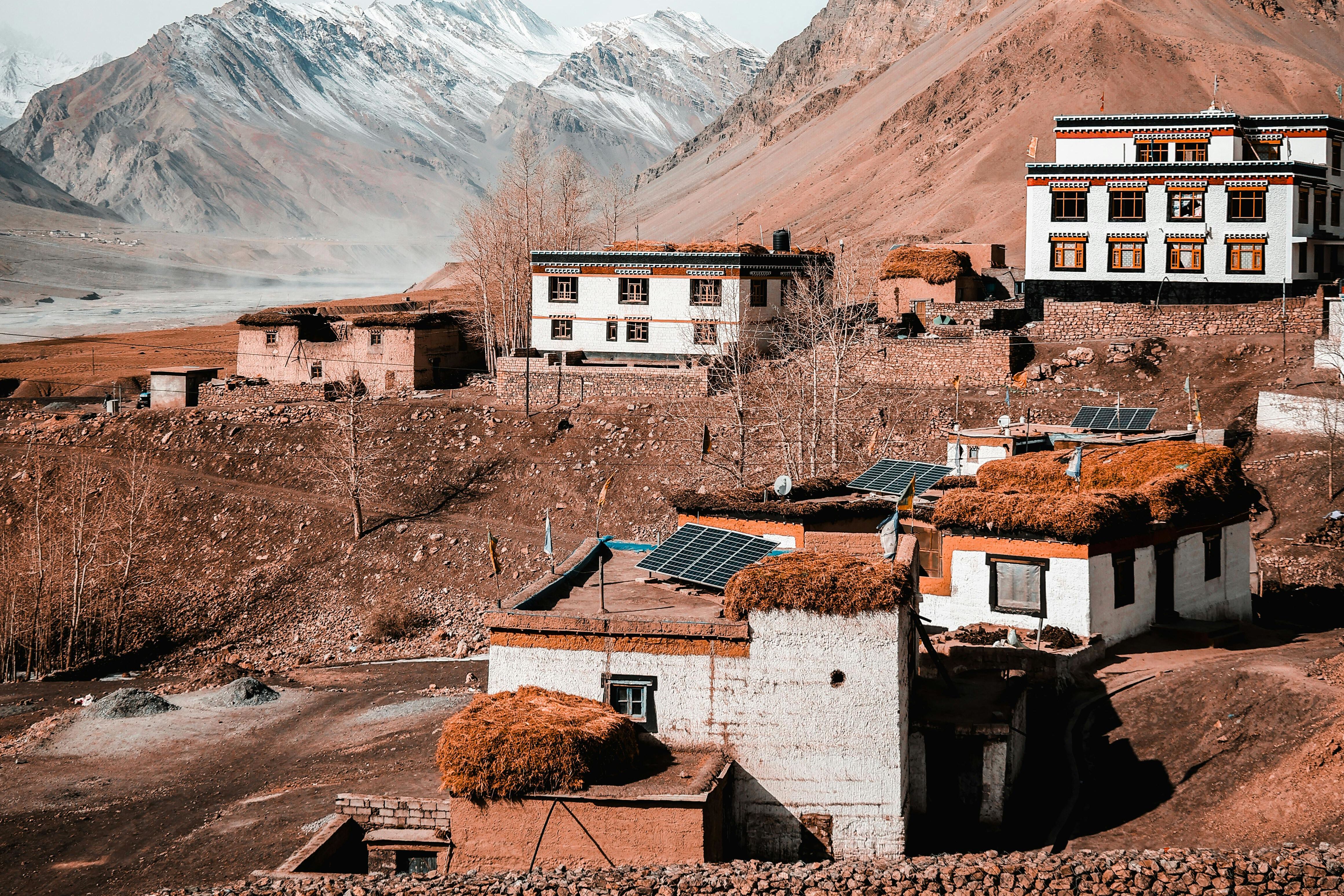 houses in hikkim village surrounded by brown mountains