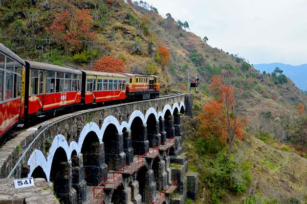 kalka shimla toy train passing over a bridge