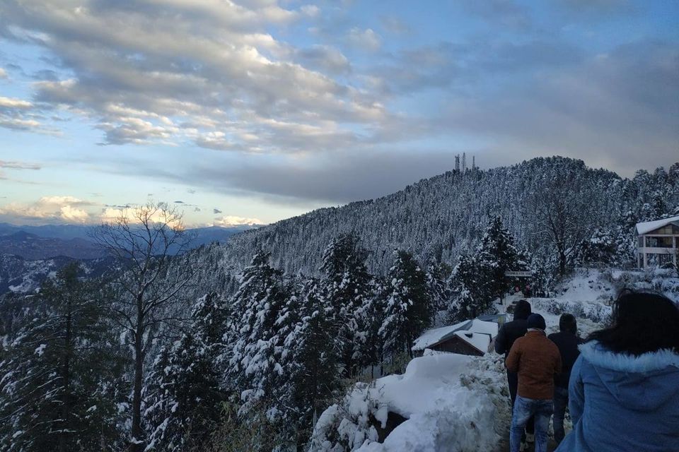 people walking on snow near kufri in winter
