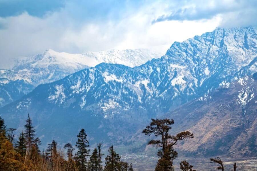 a view of snow covered mountain near mahasu peak during daytime